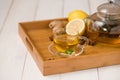 Cup of ginger tea with lemon and honey on white wooden background. Royalty Free Stock Photo