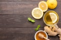 Cup of ginger tea with lemon and honey on wooden background Royalty Free Stock Photo