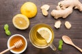 Cup of ginger tea with lemon and honey on wooden background Royalty Free Stock Photo