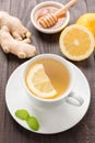 Cup of ginger tea with lemon and honey on wooden background Royalty Free Stock Photo