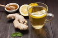 Cup of ginger tea with lemon and honey on wooden background Royalty Free Stock Photo