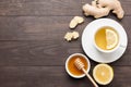 Cup of ginger tea with lemon and honey on wooden background. Cop Royalty Free Stock Photo