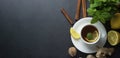 Cup of ginger tea with lemons and mint leaves on dark background. Banner, cold and autumn time