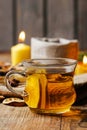 Cup of golden tea in evening candle light Royalty Free Stock Photo