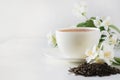 Cup of green jasmin tea white jasmine flowers. Teatime. Copy space