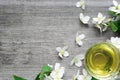 Cup of green jasmine tea and Jasmine flowers on rustic wooden background Royalty Free Stock Photo