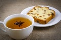 A cup of green tea with an anise-star and a delicious piece of cake Royalty Free Stock Photo