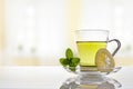 Cup of green tea with mint and lemon front view Royalty Free Stock Photo