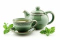 Cup of green tea and teapot isolated on white Royalty Free Stock Photo