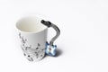 A cup with guitar handle. A cup for musician. Cup ispolated on white background.Copy space Royalty Free Stock Photo