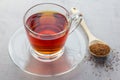 Cup of healthy herbal rooibos red tea in glass cup