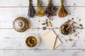 Cup of healthy tea, honey, healing herbs, herbal tea assortment and berries on table. Top view. Herbal medicine. Royalty Free Stock Photo