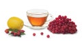 Cup of healthy tea, lemon and berries of viburnum