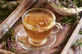 A cup of heather tea on a table Royalty Free Stock Photo