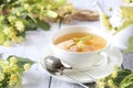 Cup of herbal linden tea with linden flowers Royalty Free Stock Photo