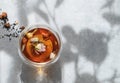 Cup of herbal tea on blue background with morning sunlight with shadow. The concept of a diet and detox drink for breakfast Royalty Free Stock Photo