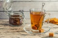 Cup of Herbal tea with cane sugar on grey wooden background Royalty Free Stock Photo