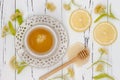 Cup of herbal tea with linden flowers, lemon and honey on a old wooden background. Top view Royalty Free Stock Photo