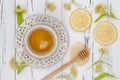 Cup of herbal tea with linden flowers, lemon and honey on a old wooden background. Top view Royalty Free Stock Photo