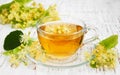 Cup of herbal tea with linden flowers Royalty Free Stock Photo