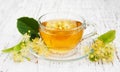 Cup of herbal tea with linden flowers Royalty Free Stock Photo