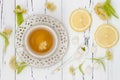 Cup of herbal tea with linden flowers on a old wooden background. Top view Royalty Free Stock Photo