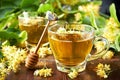 Cup of herbal tea with linden flowers on  old wooden table Royalty Free Stock Photo