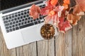 Cup of herbal tea on table with laptop Royalty Free Stock Photo