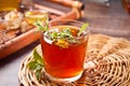 Cup of herbal tea with teapot and wooden tray with various dry herbs Royalty Free Stock Photo