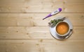 A cup of herbal tea with waves. With a thermometer and flowers on a saucer. In warm tones. Royalty Free Stock Photo