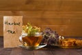 Cup of herbal tea with wild flowers and various herbs Royalty Free Stock Photo