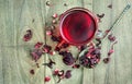 A cup of hibiscus tea on a wooden table. top view Royalty Free Stock Photo