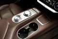 Cup holders inside modern car interior. Royalty Free Stock Photo