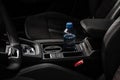 Cup holders inside modern car interior. Interior view of modern car. Royalty Free Stock Photo
