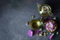 Cup of hollyhock tea with dried and fresh hollyhock blossom