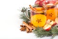 Cup of hot apple cider with cinnamon, anise and orange