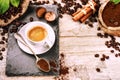 Cup of hot black coffee in setting with roasted coffee beans Royalty Free Stock Photo