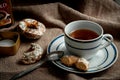 A cup of hot black tea with gingerbread cookies. Royalty Free Stock Photo