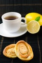 Cup of hot black tea, lemon, homemade cookies Royalty Free Stock Photo