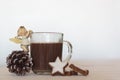 Cup of Hot chocolate with christmas angel, pine cone and cookies Royalty Free Stock Photo