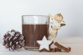 Cup of hot chocolate with cookies and pine cone and Christmas angel Royalty Free Stock Photo