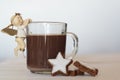 Cup of hot chocolate decorated with christmas angel and delicious homemade cookies Royalty Free Stock Photo