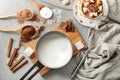 Cup of hot chocolate with ingredients on grey table Royalty Free Stock Photo