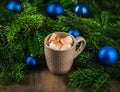 Cup of hot chocolate with marshmallow on the wooden table. Christmas decorations. Selective focus. Shallow depth of field Royalty Free Stock Photo