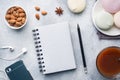 Cup of hot chocolate and marshmallows, almonds and a Notepad for text on the table. christmas planning concept. Flat lay style Royalty Free Stock Photo