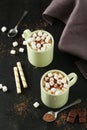 Cup of hot chocolate with marshmallows on black background Royalty Free Stock Photo