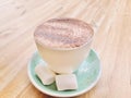 A cup of hot chocolate on mint color cup with marshmallow. Warm tone. Royalty Free Stock Photo