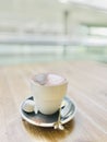 A cup of hot mocha in a white cup with a marshmallow at breakfast time. Royalty Free Stock Photo