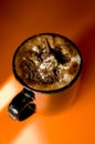 Cup of Hot Chocolate on Vibrant Orange Background