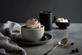 a cup of hot chocolate with whipped cream and chocolate shavings on a plate next to a cup of coffee Royalty Free Stock Photo